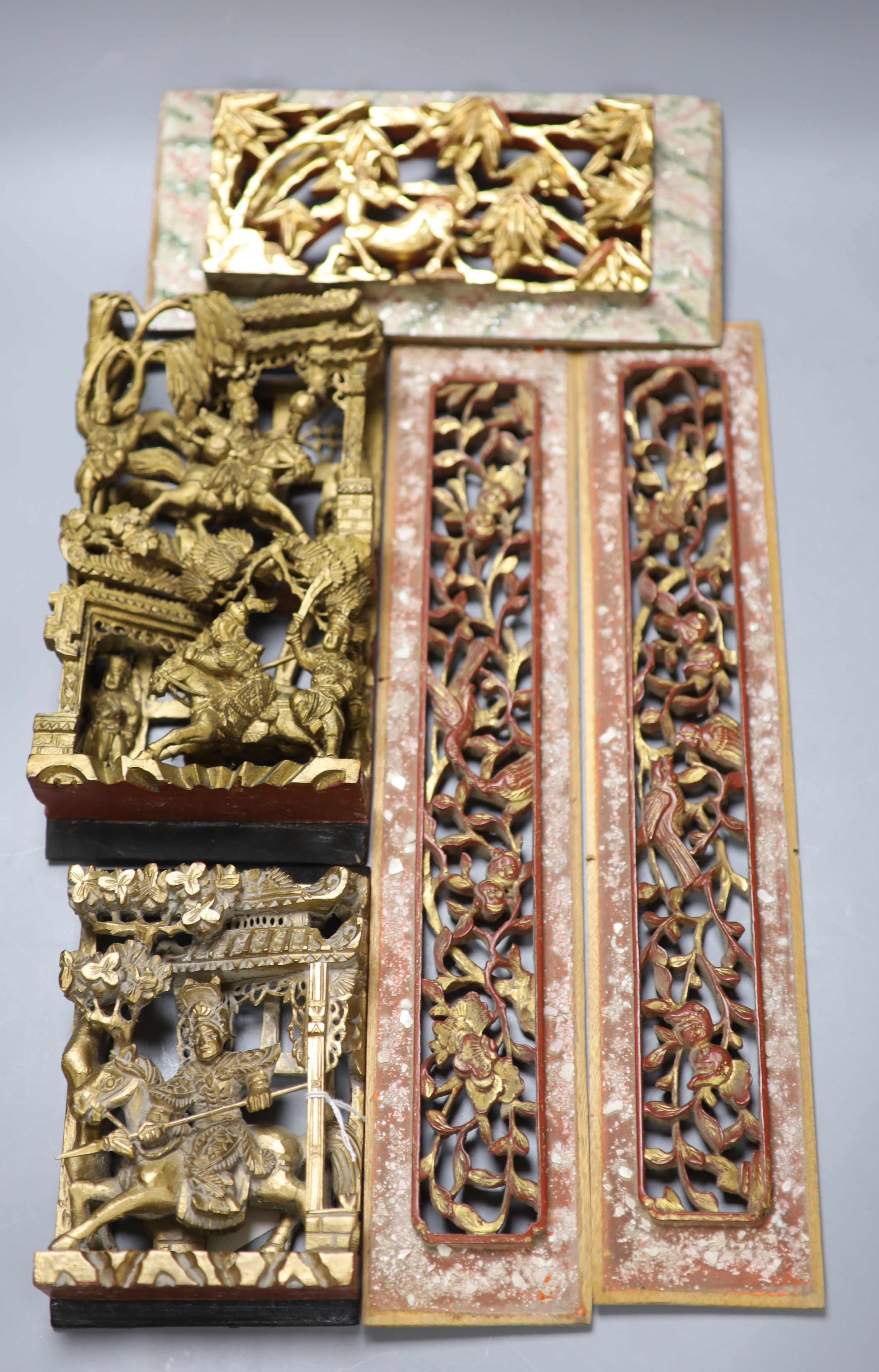 Five Chinese lacquer carved panels, longest 42cm